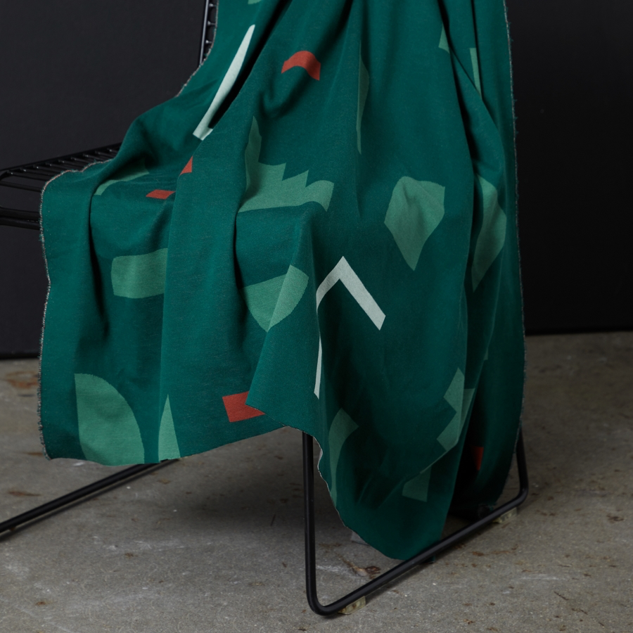 Jacquard géométrique vert bouteille